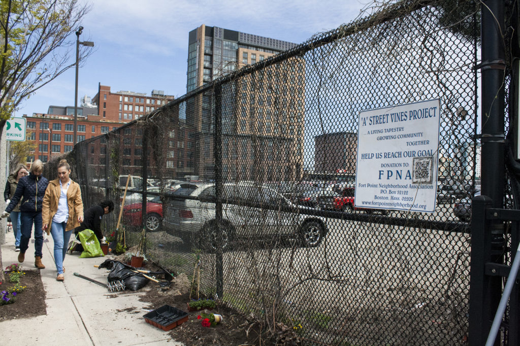 Volunteers along A Street, in front of the site of the Boston Shines clean-up area, on Friday, April 29, 2016. (Photo by Susan Doucet)