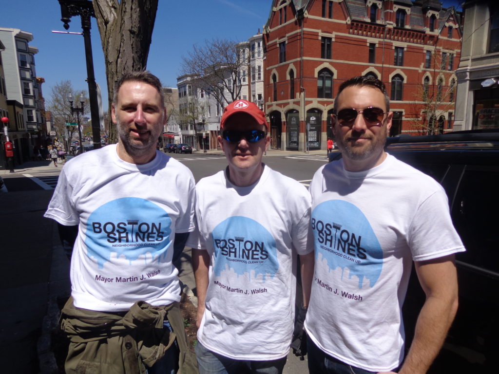 Members of the Saint’s Vincent’s Association were planting flowers on West Broadway. (Photo by Kevin Devlin)