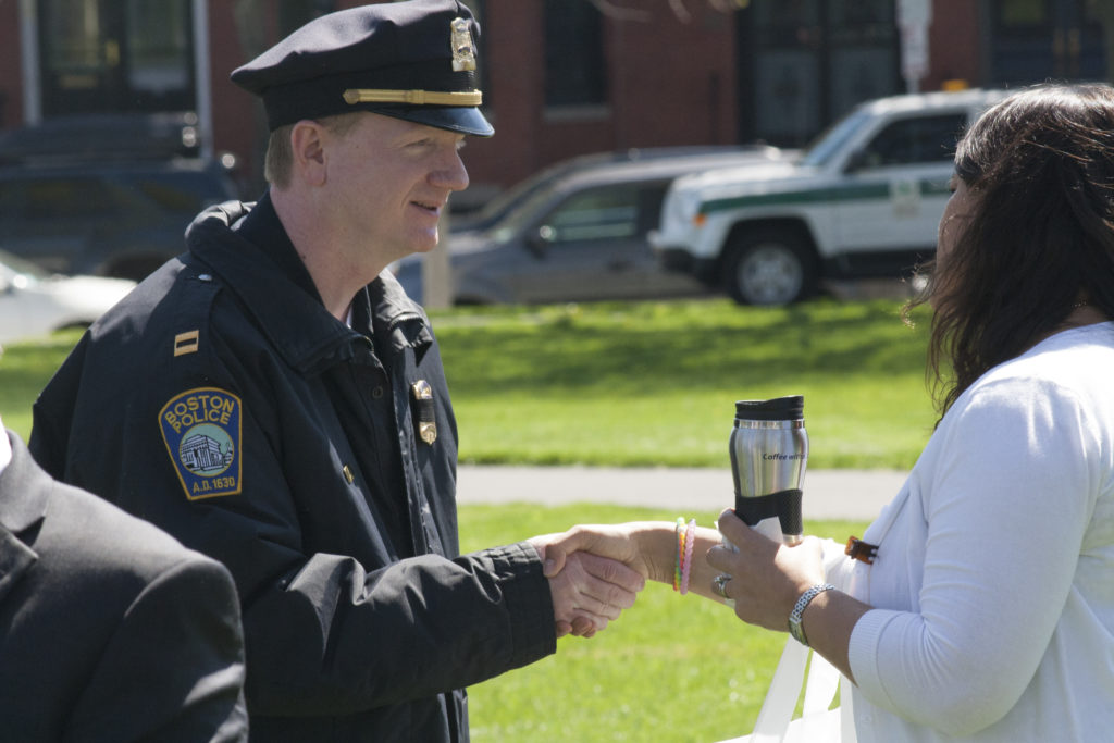 Boston Police Department Capt. Joseph Boyle greets Boston City Councilor Annissa Essaibi George at the neighborhood coffee hour at Medal of Honor Park on Tuesday, May 10, 2016. Boyle recently joined the department's District C-6 in South Boston as the local commanding officer, replacing Capt. John Greland. (Photo by Susan Doucet)