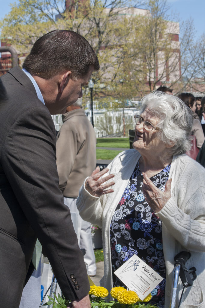 Mary Roca of South Boston speaks to Boston Mayor Martin J. Walsh at the neighborhood coffee hour at Medal of Honor Park on Tuesday, May 10, 2016. (Photo by Susan Doucet)