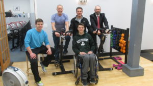 A “Southie time” gathering at Regan’s Motivated Fitness – Thomas Reagan (trainer), Tom Regan (rider), Mark Delamere (father), Mark Delamere (son), and Michael Kineavy (rider). The third rider, not shown, is Tim Connolly. (Photo by Rick Winterson)